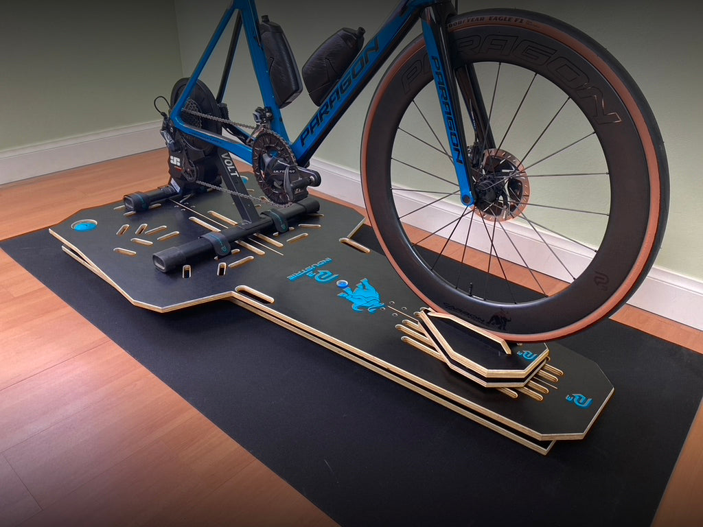 Paragon P3 Full-Motion Rocker Plate system supporting an indoor smart trainer setup